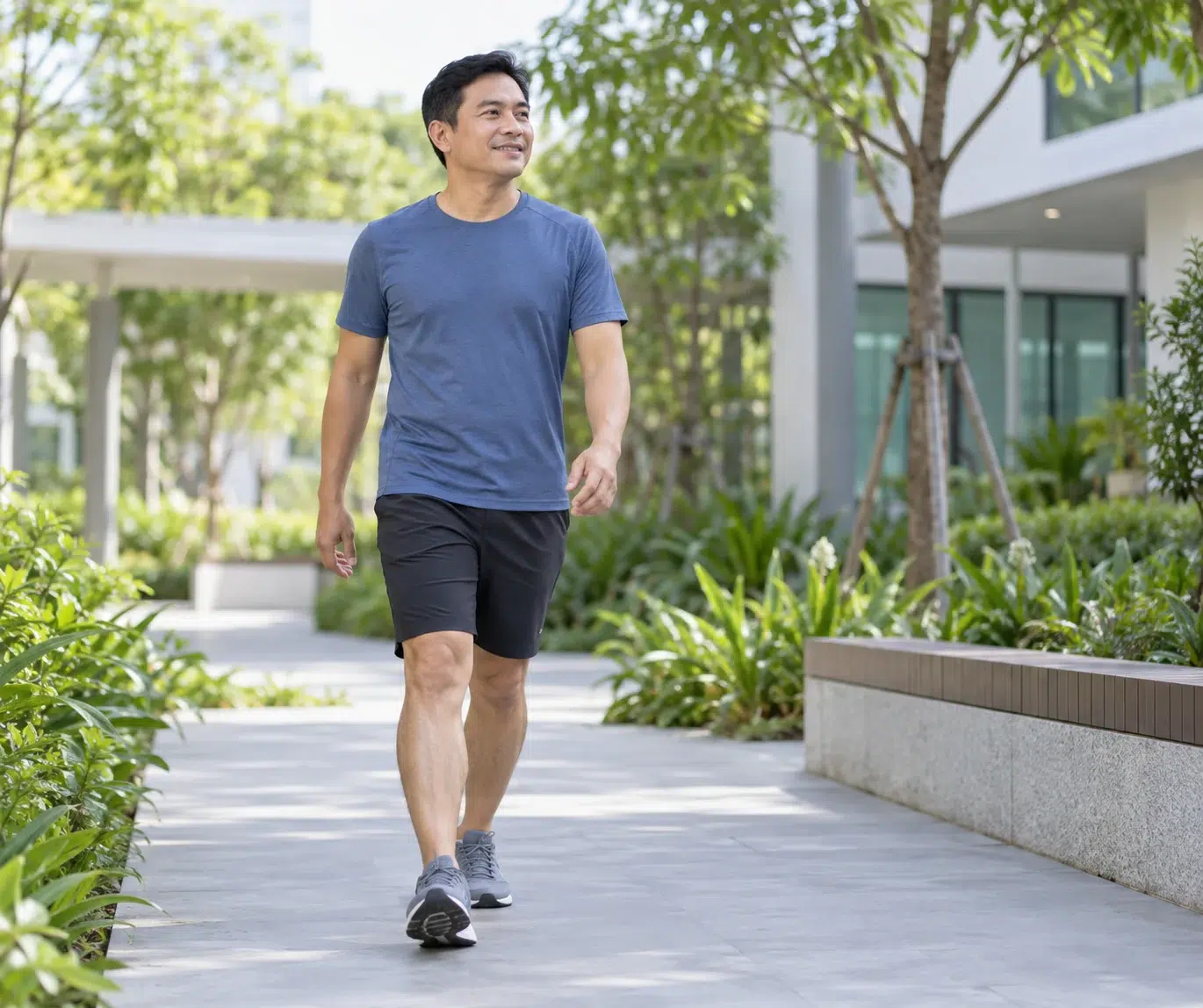 An adult walks gently on a flat path as part of everyday activity.